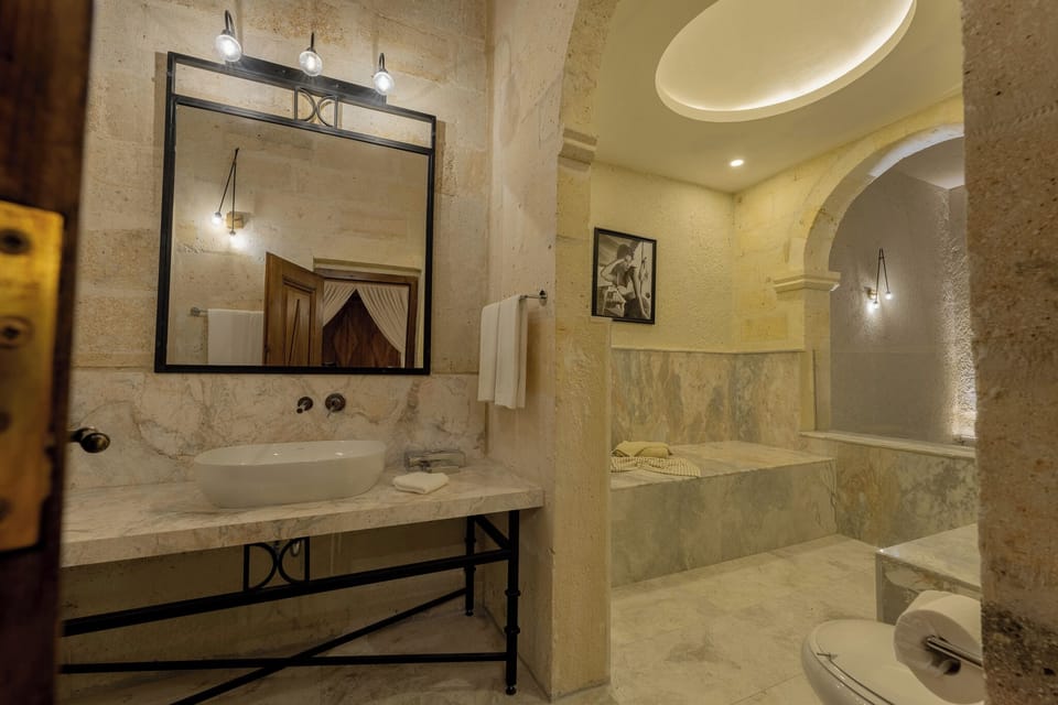 Romance Suite | Bathroom | Separate tub and shower, hair dryer, bathrobes, slippers