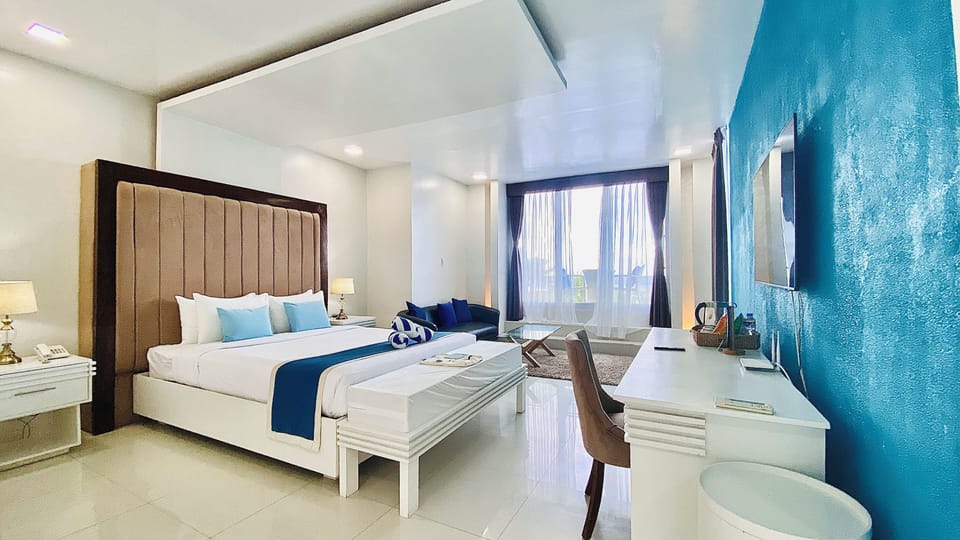 Deluxe Room | In-room safe, desk, laptop workspace, blackout drapes