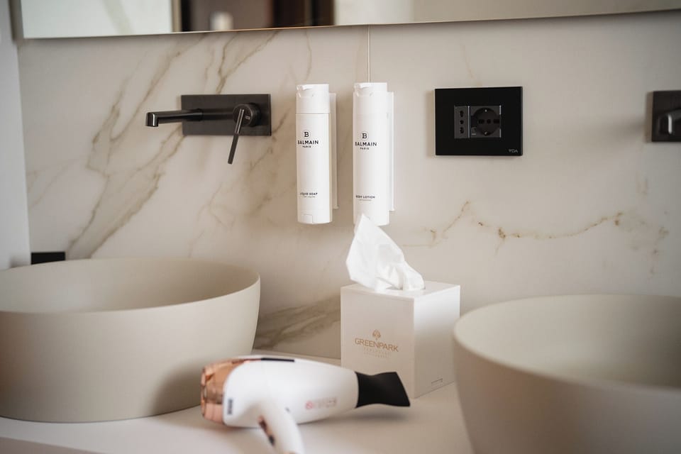 Luxury Suite, Pool View | Bathroom | Shower, hair dryer, slippers, towels