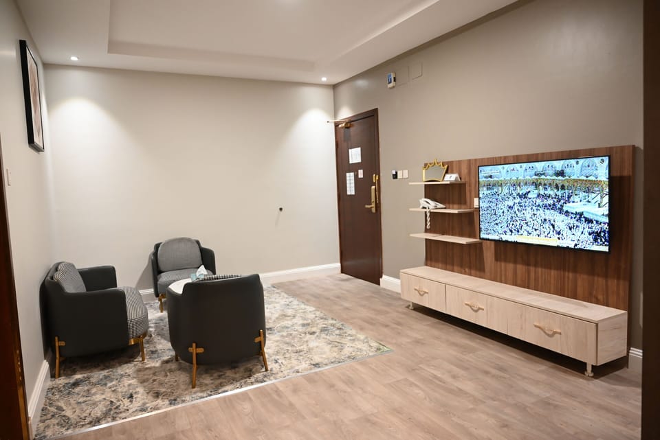 Family Suite | Living area | 120-cm Smart TV with satellite channels