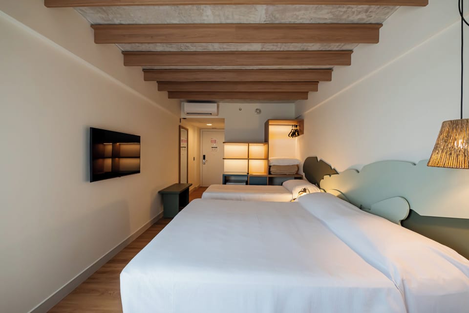 Standard Room, Multiple Beds | Minibar, in-room safe, blackout drapes, soundproofing