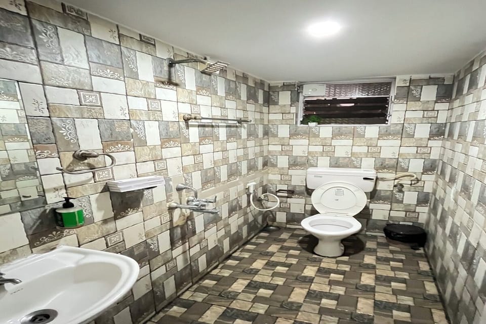 Semi Deluxe Room - Palm View Retreat | Bathroom | Shower, free toiletries, towels, soap