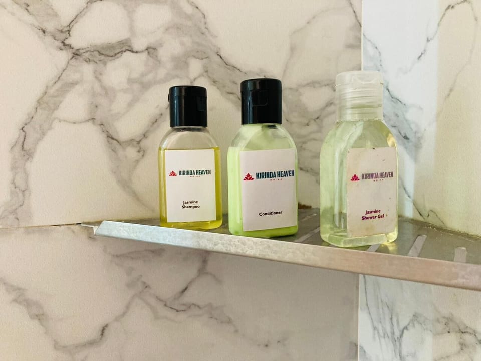 Family Quadruple Room | Bathroom | Shower, hair dryer (on request), towels, soap