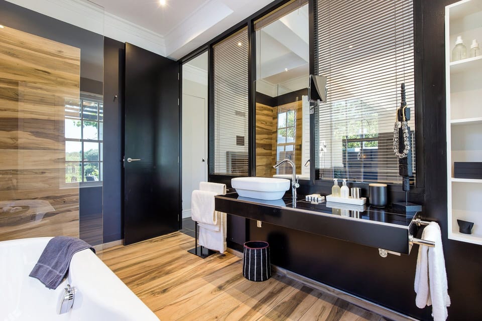 Luxury Suite, Garden View | Bathroom | Separate tub and shower, jetted tub, rainfall showerhead
