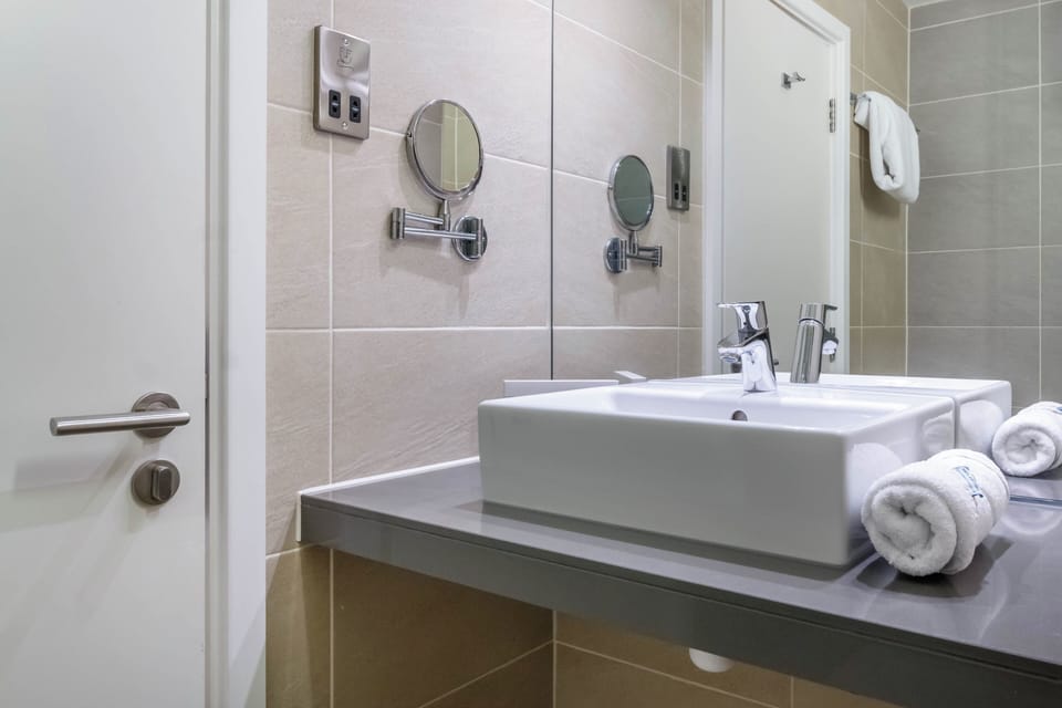 Shower, rainfall showerhead, hair dryer, towels