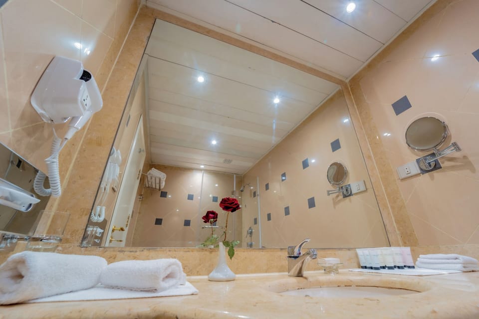 Combined shower/tub, hair dryer, towels, soap