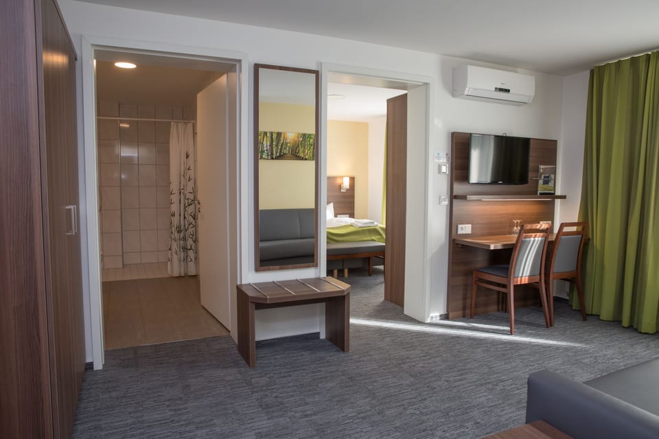 Triple Room | Minibar, in-room safe, desk, soundproofing