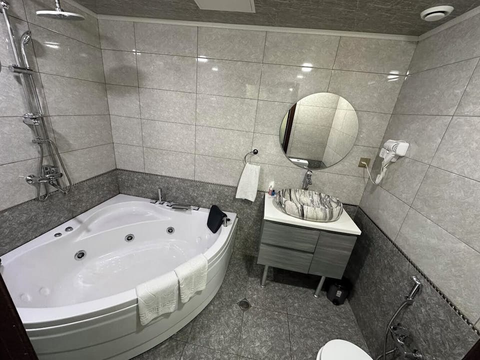 Separate tub and shower, hair dryer, towels, soap