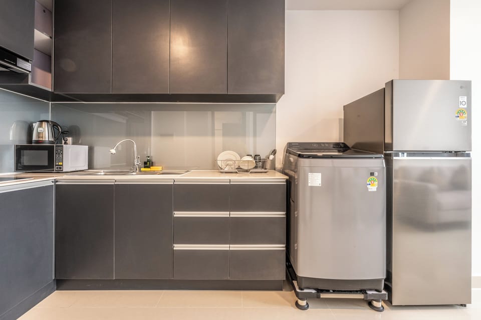 Comfort Condo, 1 Queen Bed, River View | Private kitchen | Fridge, cookware/dishes/utensils, dining tables