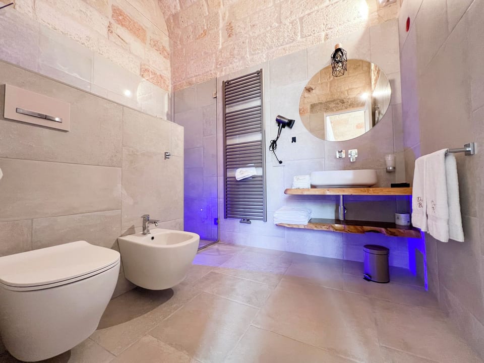 Deluxe Suite, Balcony, City View | Bathroom | Separate tub and shower, hair dryer, slippers, bidet