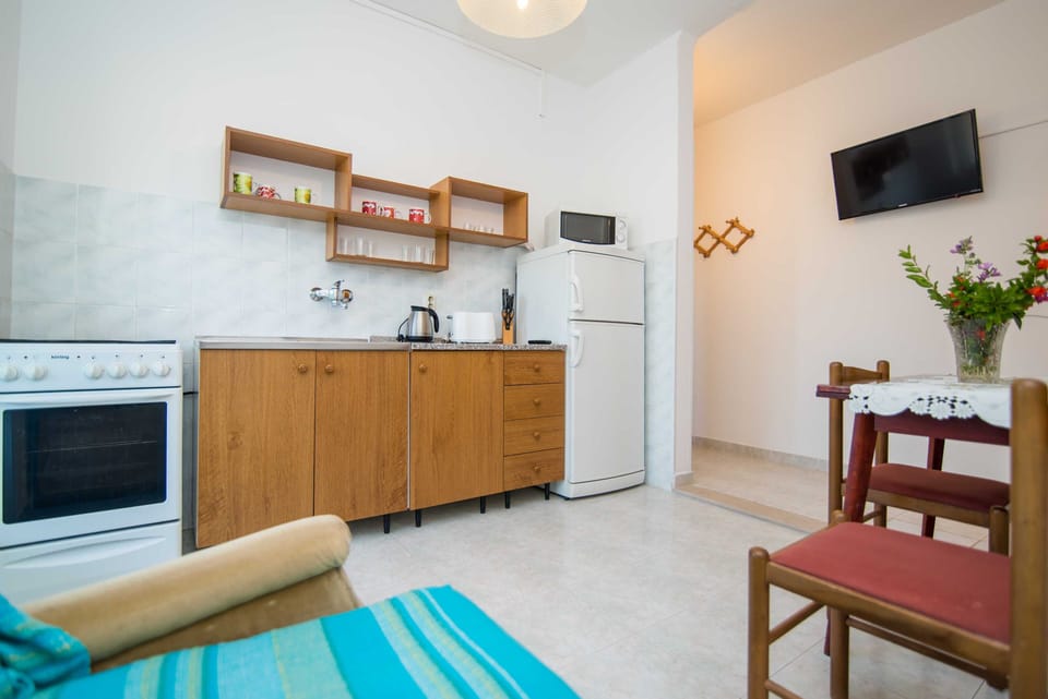 Apartment (Two Bedroom Apartment with Balcony an) | Living room | 32-inch flat-screen TV with cable channels