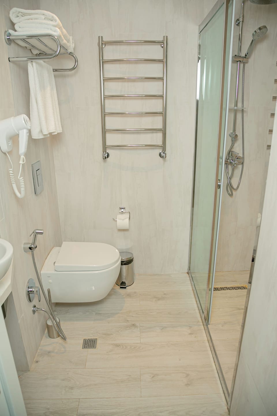 Shower, hair dryer, slippers, towels