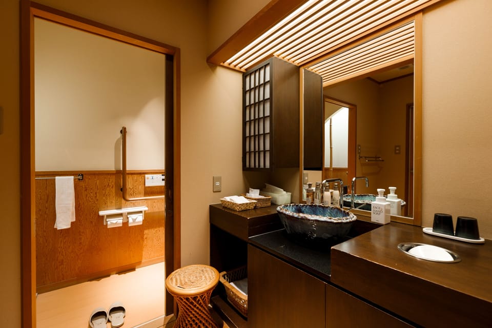 Deluxe room A , Non Smoking | Bathroom | Hair dryer, slippers, bidet, towels