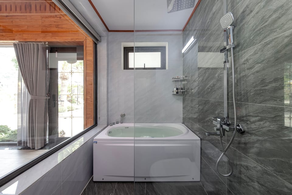 Family Twin Room, Pool View | Bathroom | Combined shower/tub, rainfall showerhead, hair dryer, bathrobes