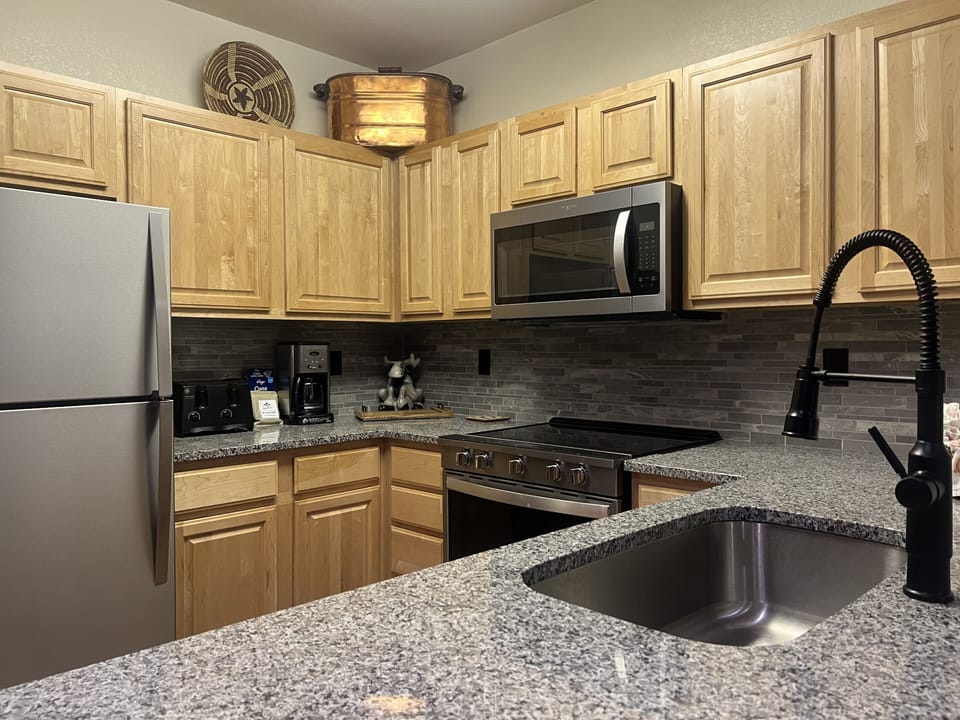 Condo, 2 Bedrooms | Private kitchen | Coffee/tea maker, fridge, oven, electric kettle
