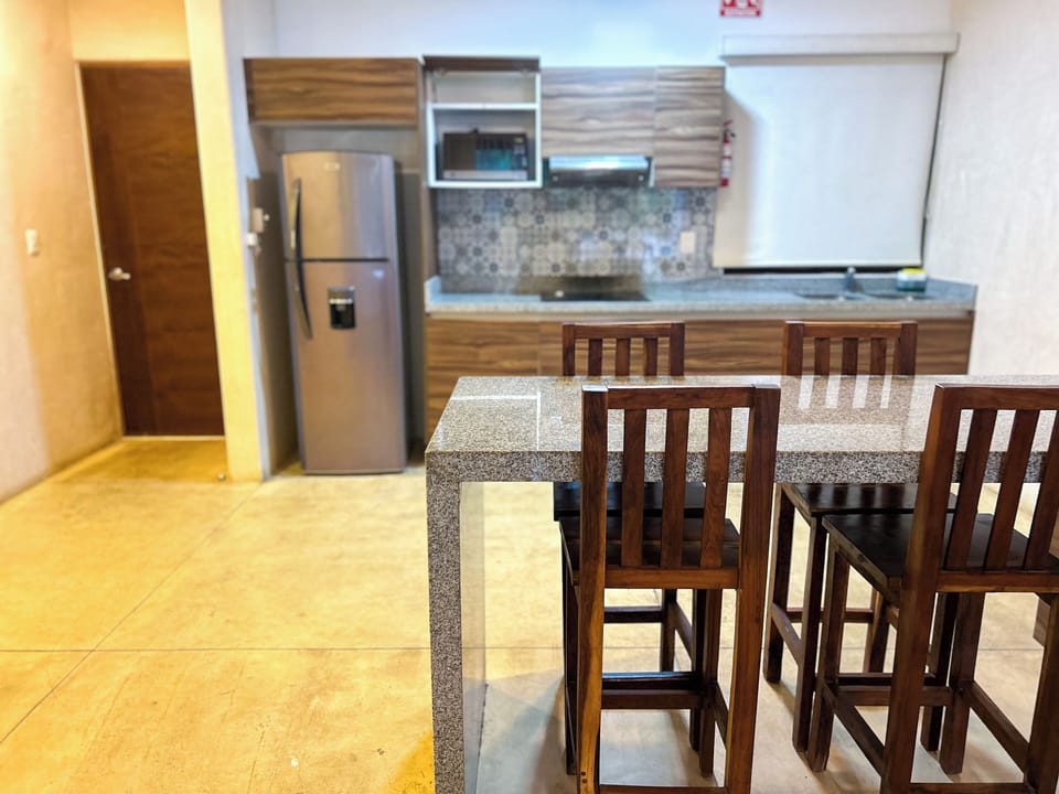 Superior Apartment, Patio | Private kitchen | Coffee/tea maker
