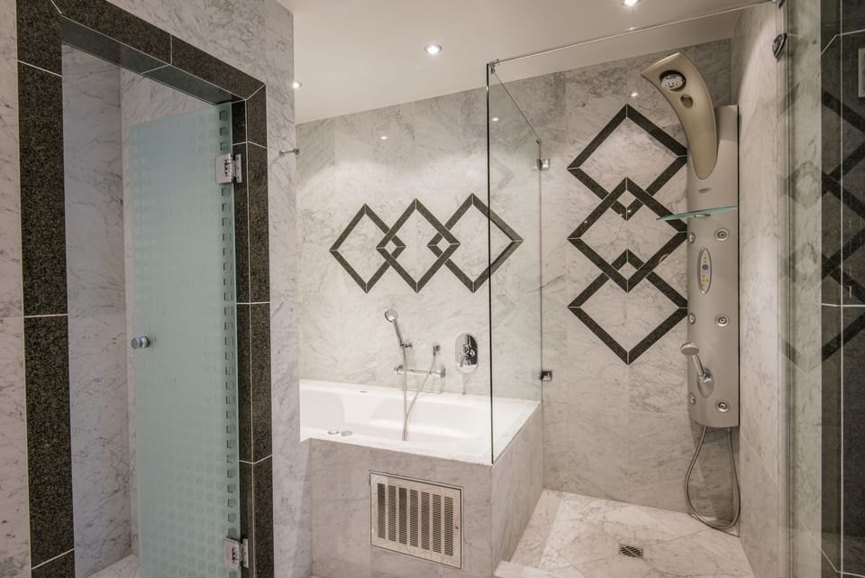 Junior Suite, 1 King Bed, Lake View | Bathroom | Shower, hair dryer, bathrobes, slippers