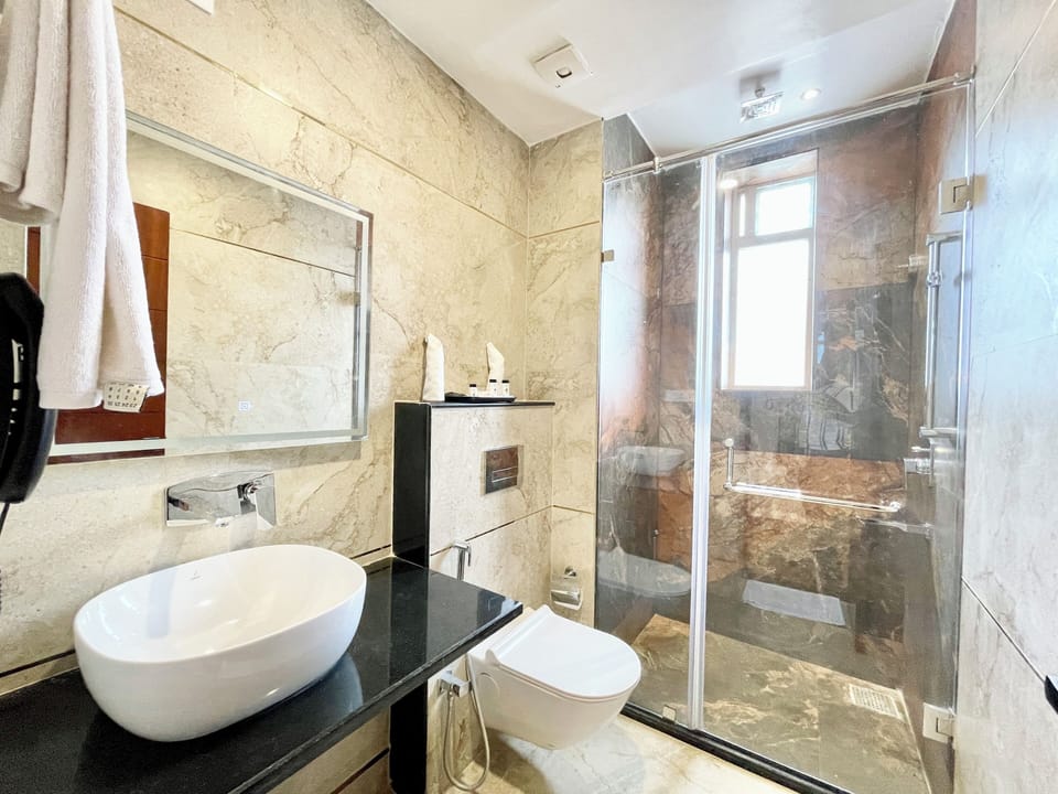 Shower, rainfall showerhead, towels, soap