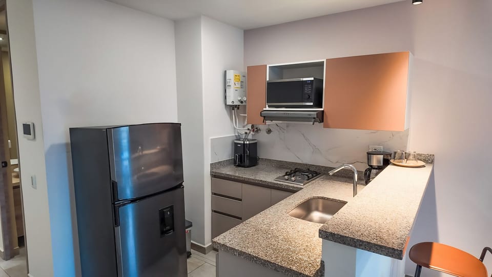 Standard Room, 1 Bedroom, City View | Private kitchen | Microwave, electric kettle, cookware/dishes/utensils
