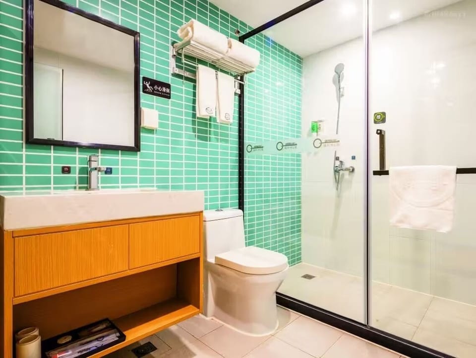 Shower, free toiletries, hair dryer, slippers