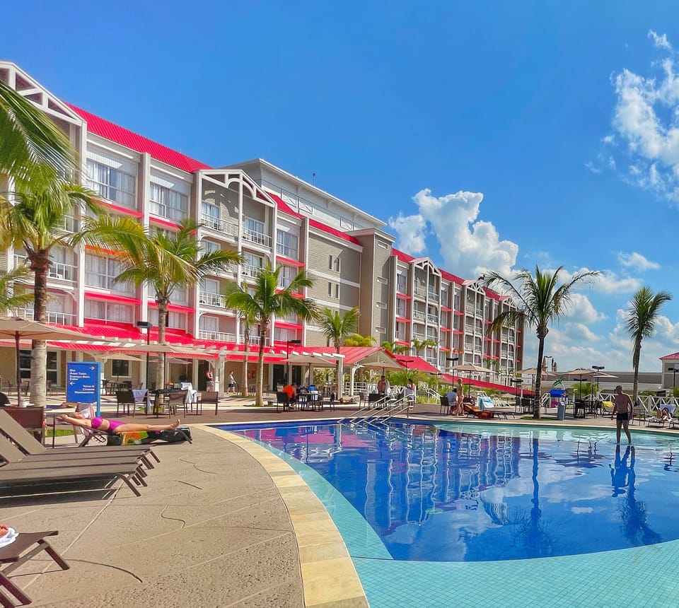 Indoor pool, 5 outdoor pools, open 8:00 AM to 10:00 PM, pool umbrellas