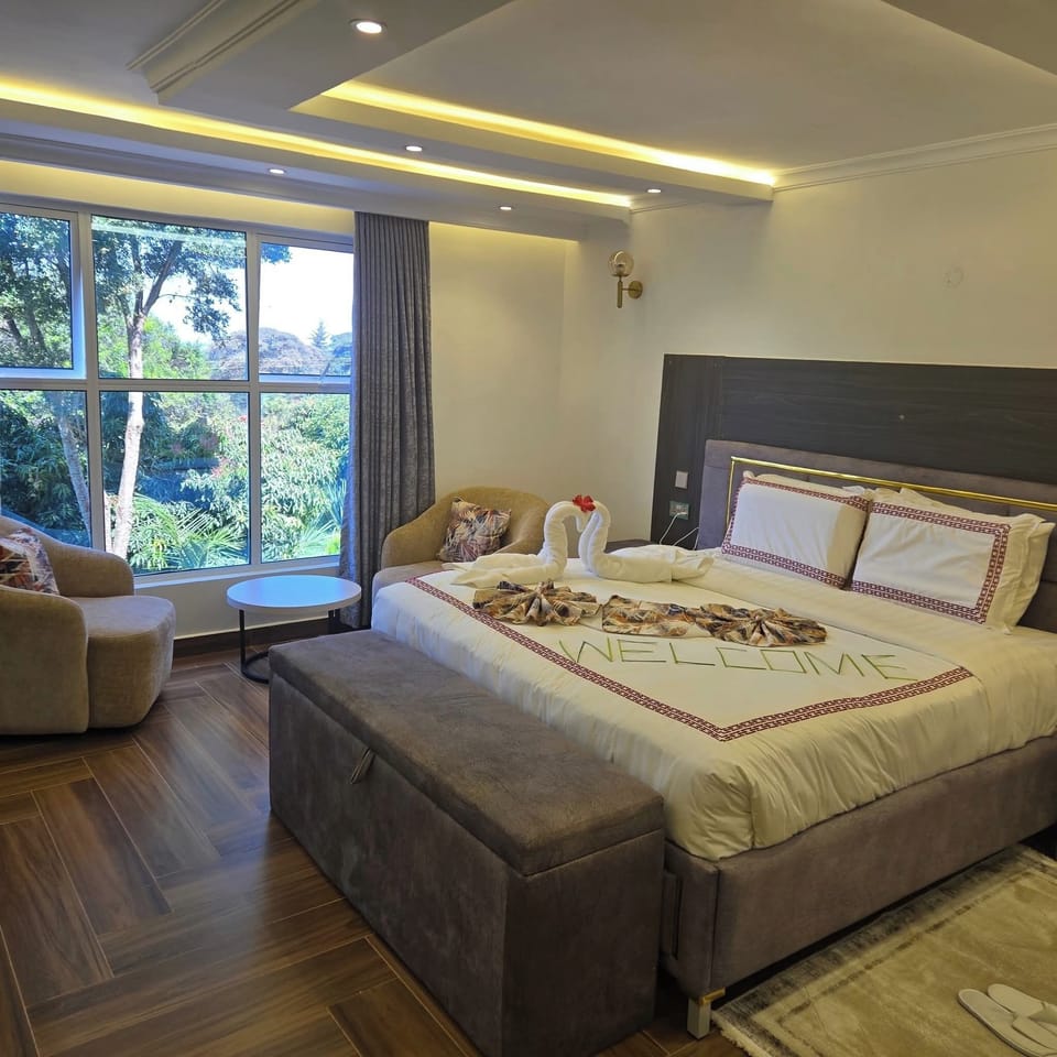 Deluxe Double Room, Balcony, Mountain View | In-room safe, laptop workspace, iron/ironing board, free WiFi