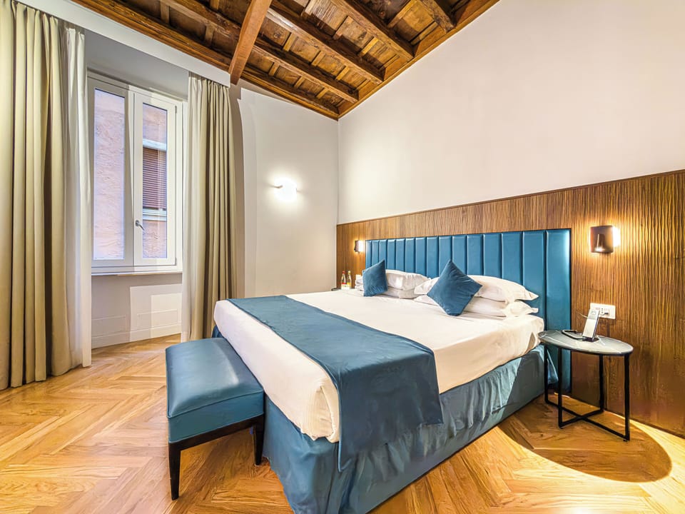 Deluxe Quadruple Room, City View | Down comforters, memory foam beds, minibar, soundproofing