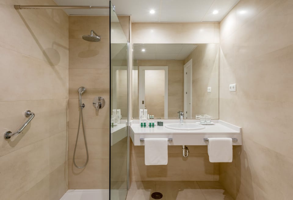 Designer toiletries, hair dryer, towels, soap