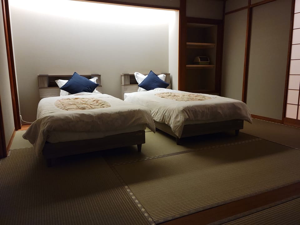Deluxe Twin Room, 2 Twin Beds, Non Smoking, Shared Bathroom | In-room safe, blackout drapes, WiFi (free), bed sheets