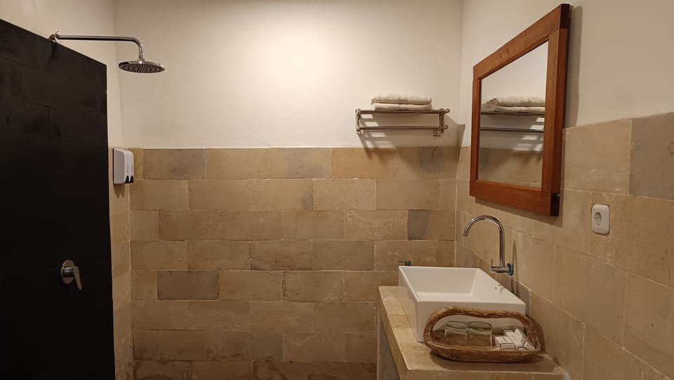 Shower, rainfall showerhead, towels, soap