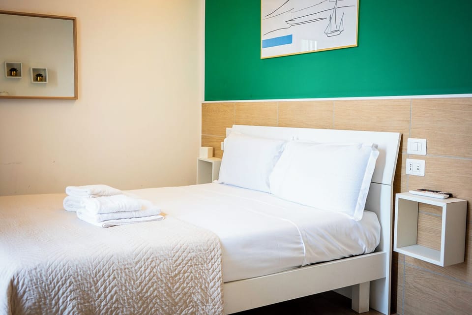 Tripla Deluxe Con Balcone | In-room safe, WiFi (free), bed sheets