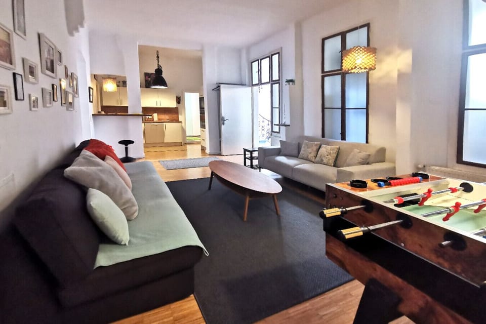 Apartment, City View | Living room | 120-cm flat-screen TV with digital channels, video-game console, toys