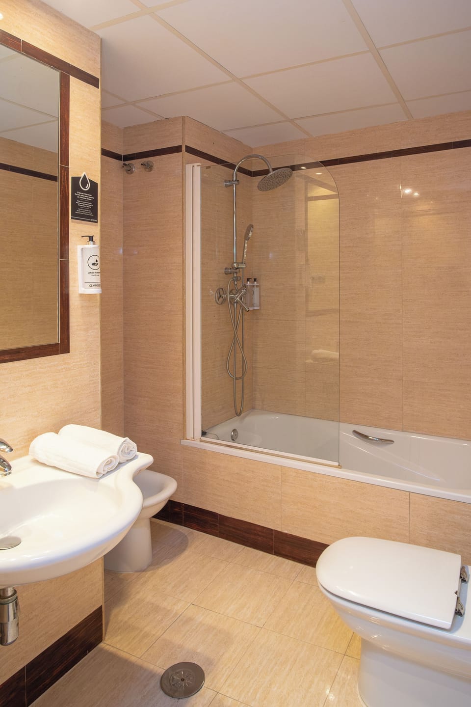 Bathtub, hair dryer, towels, soap