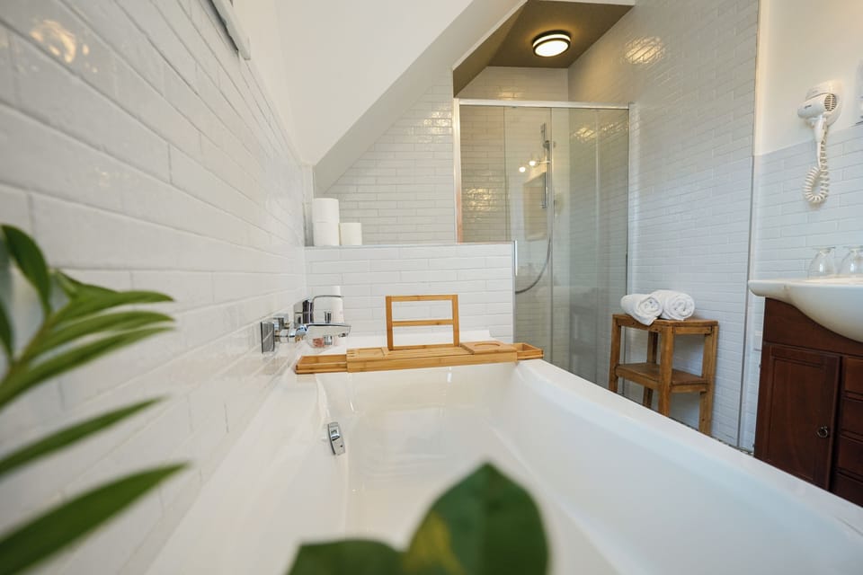 Superior Quadruple Room | Bathroom | Shower, hair dryer, towels, soap