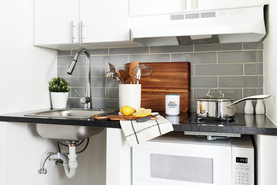 Full-size fridge, microwave, stovetop, freezer