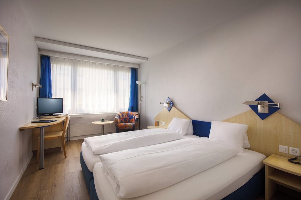 Comfort Quadruple Room, Courtyard View | Premium bedding, down comforters, desk, free WiFi