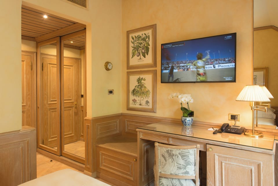 Single Room (French Bed) | Living area | 50-inch TV with satellite channels, streaming services