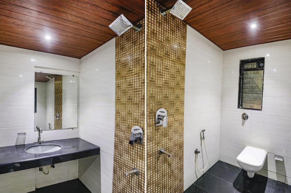Shower, rainfall showerhead, towels, toilet paper