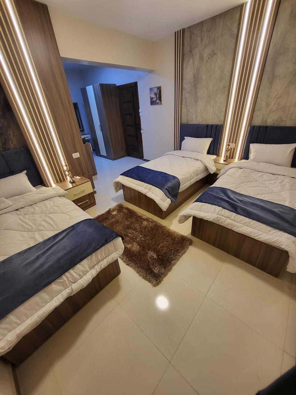 Triple Room, Balcony, City View | Minibar, blackout drapes, soundproofing, iron/ironing board
