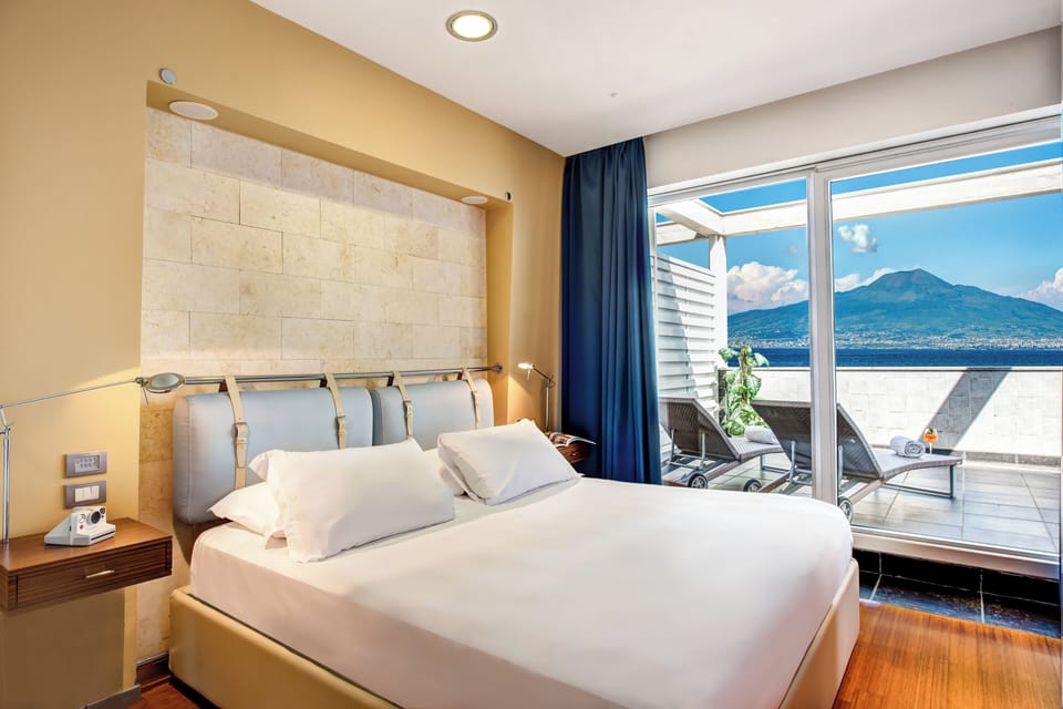 Premium bedding, down comforters, minibar, in-room safe