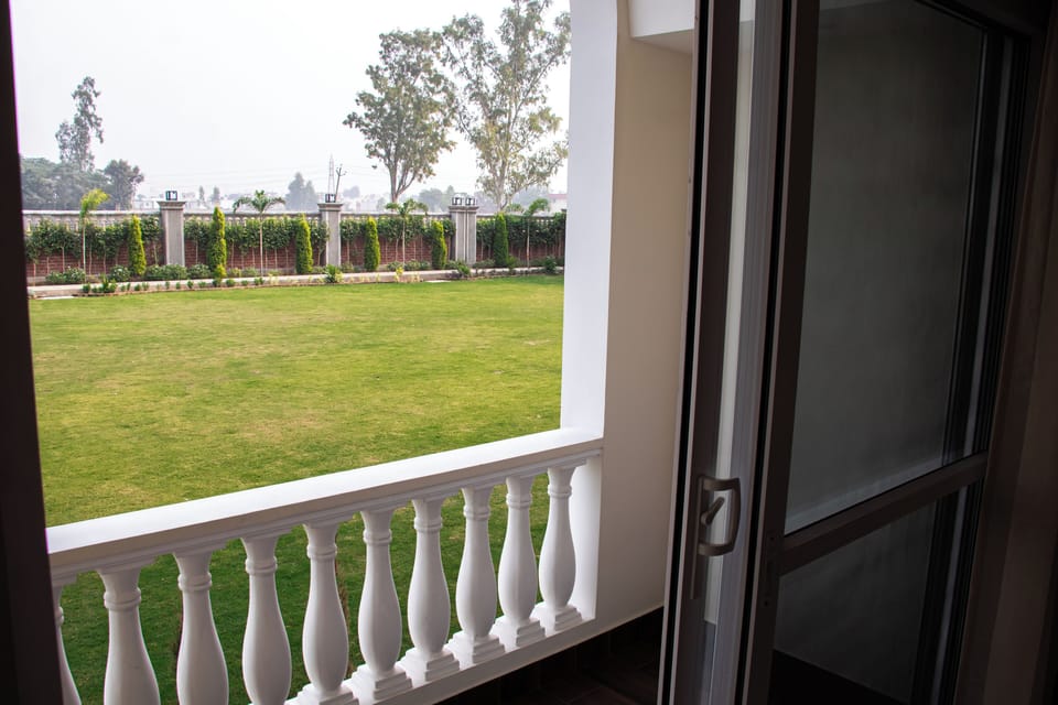 Deluxe Room, Garden View | Terrace/patio