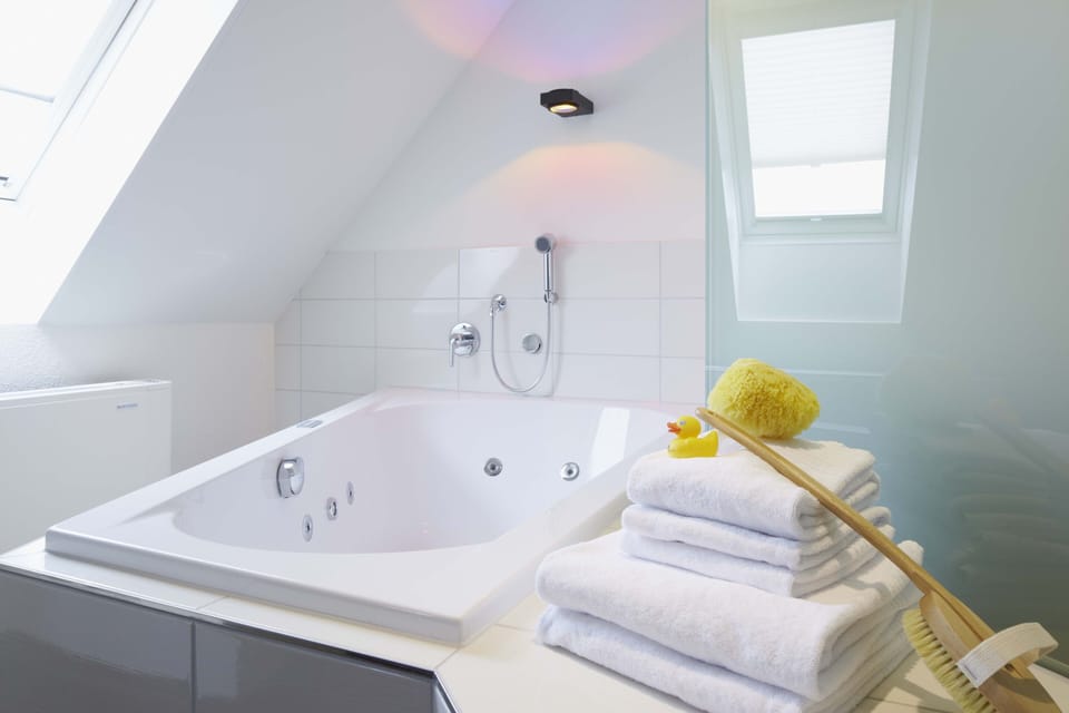 Designer toiletries, hair dryer, towels, soap