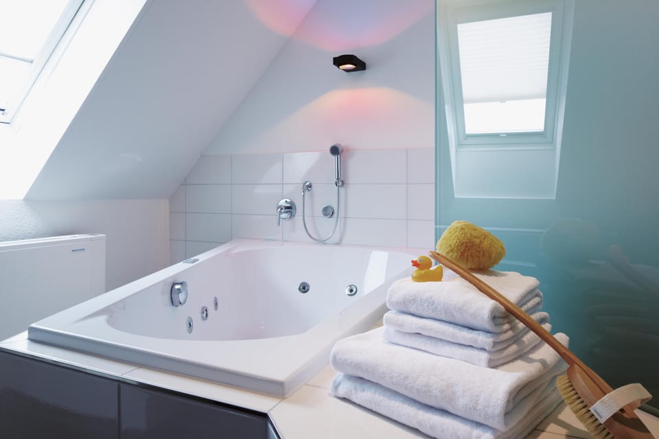 Designer toiletries, hair dryer, towels, soap