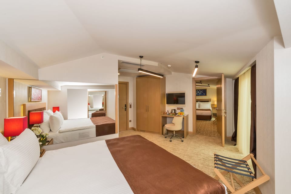 Family Room, 2 Bedrooms, 2 Bathrooms, City View | Minibar, in-room safe, desk, laptop workspace