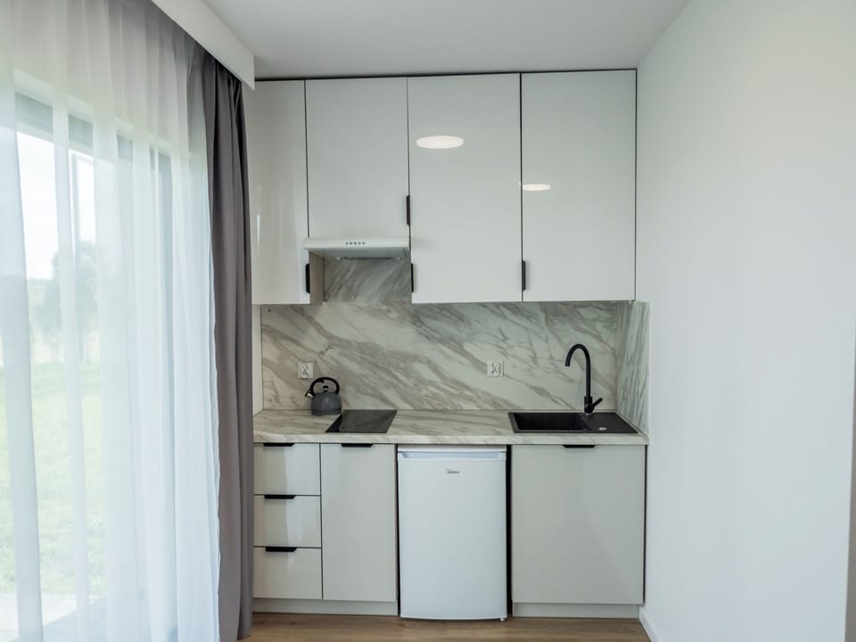 Luxury Double Room, Kitchenette | Private kitchenette | Fridge, stovetop, highchair, cookware/dishes/utensils