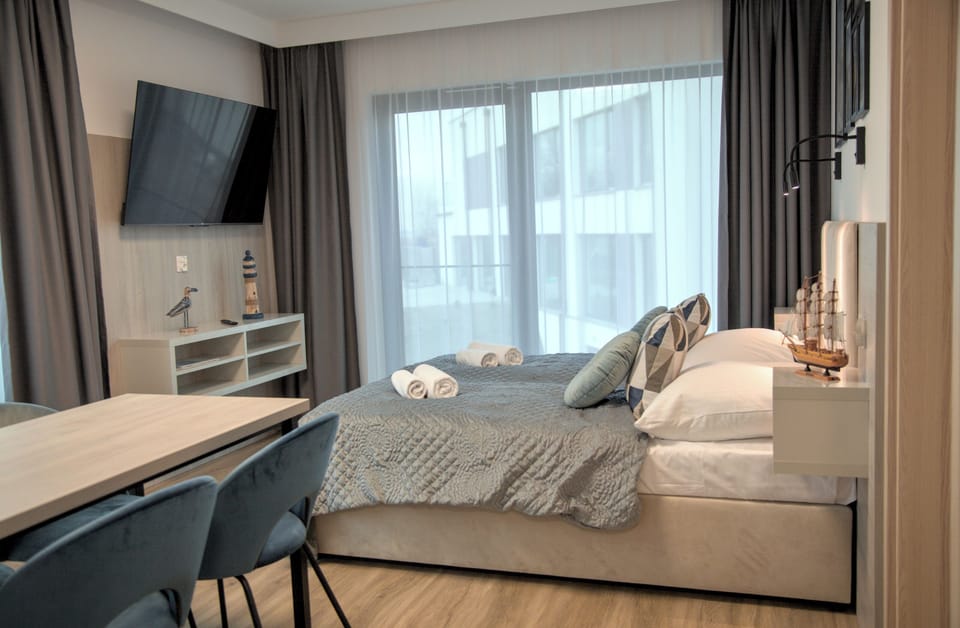 Family Apartment | Laptop workspace, blackout drapes, soundproofing, iron/ironing board