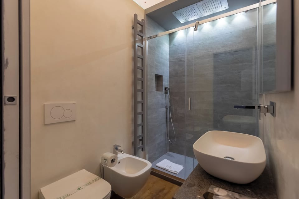 Deluxe Studio Suite | Bathroom | Slippers, bidet