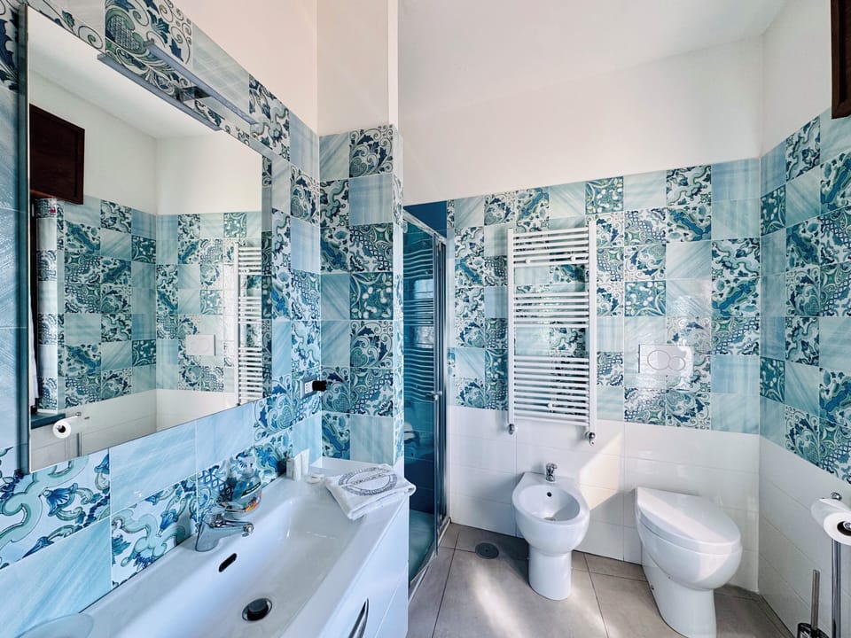 Superior Double Room, City View | Bathroom | Shower, hair dryer, towels, soap