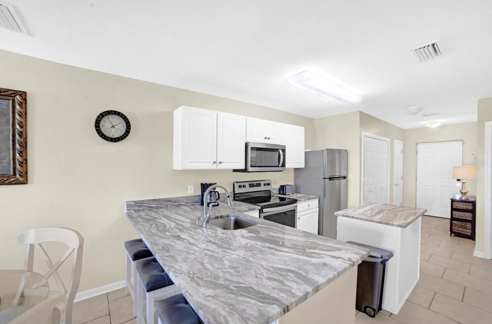 Condo, Multiple Beds (Grand Caribbean 209) | Private kitchen | Oven, dishwasher, toaster