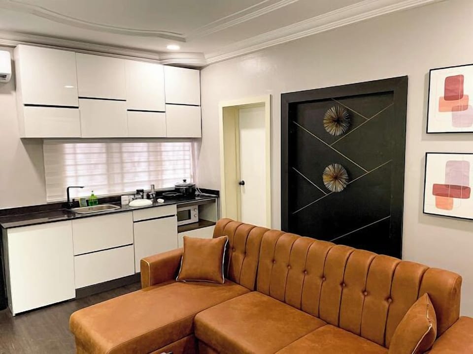 Family Apartment, Balcony, City View | Living area | Flat-screen TV